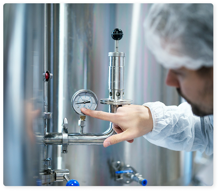 Validation engineer checking gauge